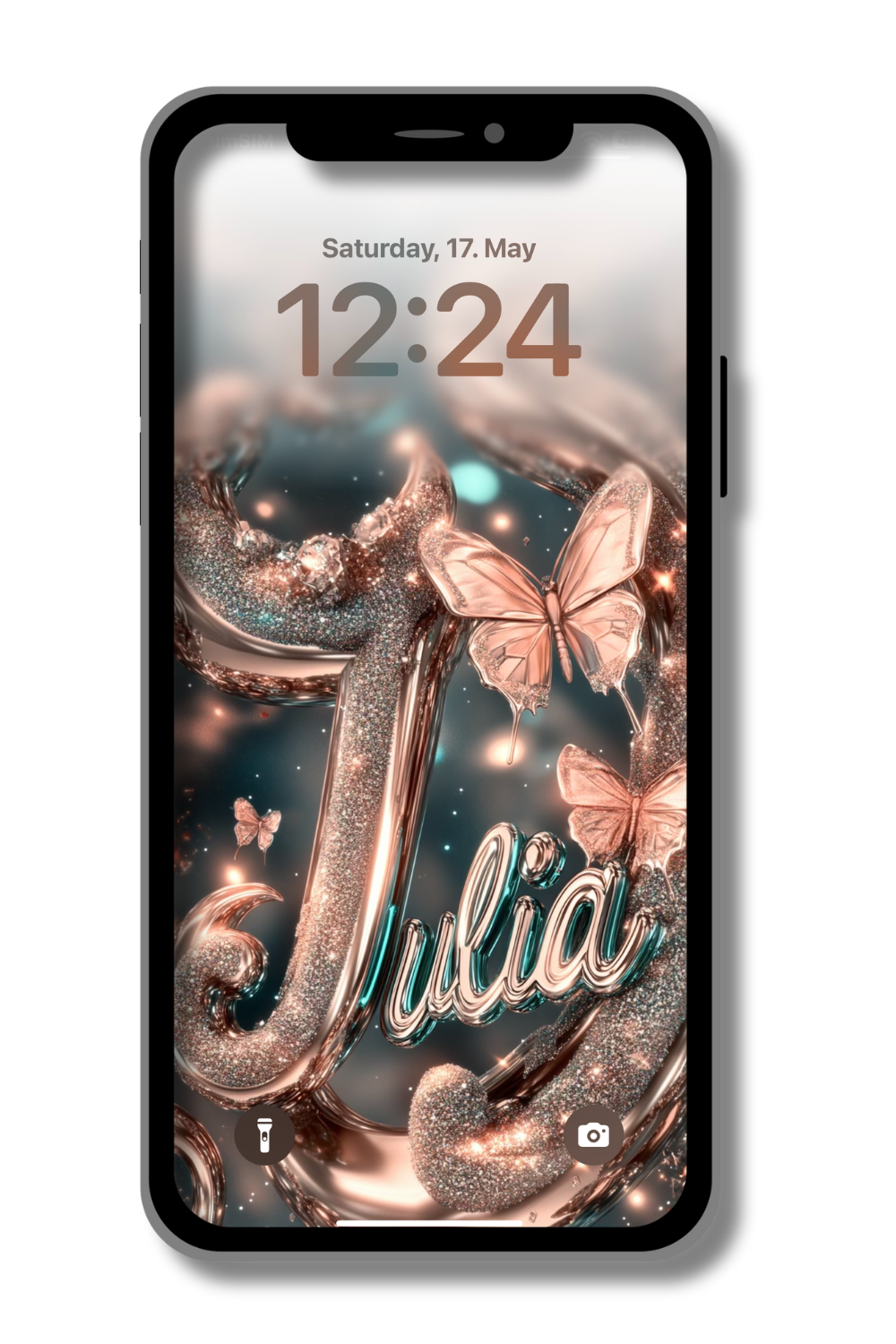A phone screen displays a sparkling wallpaper with the name "Julia" in teal script outlined in rose gold. Rose gold butterflies with translucent wings flutter around the name and abstract, shimmering shapes in teal and rose gold. The time reads "12:24" and the date is "Saturday, 17. May."
