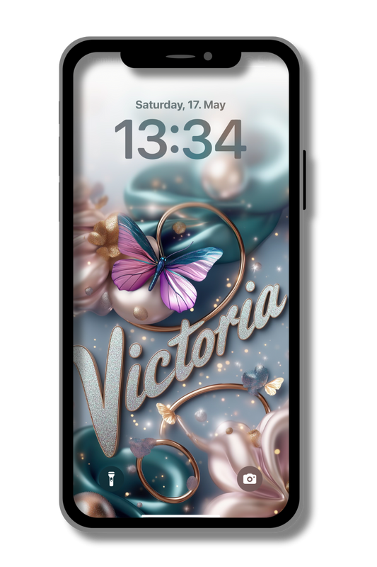 A smartphone screen displays a personalized lock screen. The date reads "Saturday, 17. May" and the time is "13:34". The wallpaper features a large, vibrant butterfly with pink and blue wings, surrounded by swirling teal and pink fabrics, gold rings, and smaller butterflies. The name "Victoria" is written in elegant, shimmering script across the center.