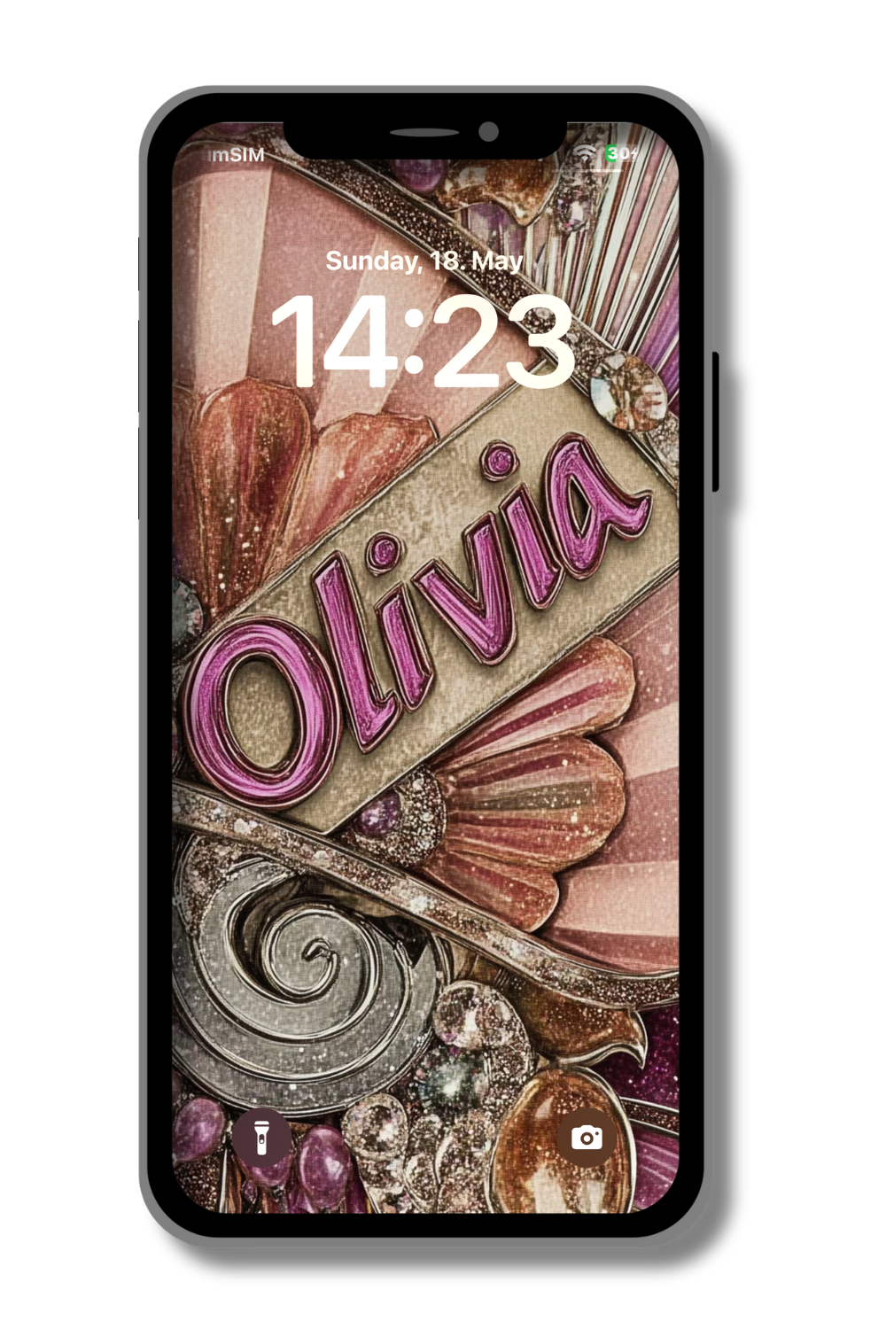 A close-up of a locked smartphone screen displays a personalized wallpaper. The name "Olivia" is prominently featured in a stylized, cursive font with a metallic pink outline and a textured beige fill. The background is a collage of vintage-inspired, glamorous elements in shades of pink, beige, silver, and gold, including decorative swirls, fan shapes, and sparkling accents. The phone's display also shows the time as 14:23 and the date, Sunday, May 18. Icons for the flashlight and camera are visible.