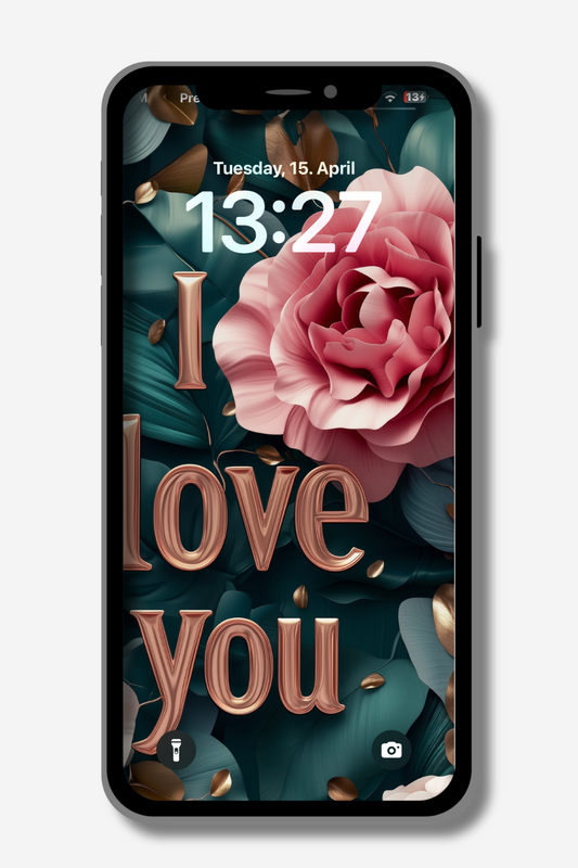 A smartphone displays a lock screen with the words "I love you" in elegant, rose-gold 3D lettering. A large, soft pink rose is prominently featured against a backdrop of dark teal leaves and scattered gold accents. The time reads 13:27 on Tuesday, April 15. Flashlight and camera icons are at the bottom.