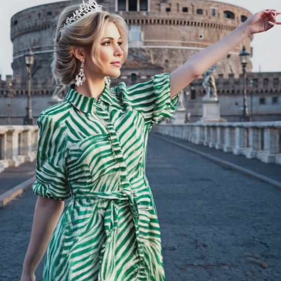 A woman with a tiara and a stylish dress walks around Rome. 
