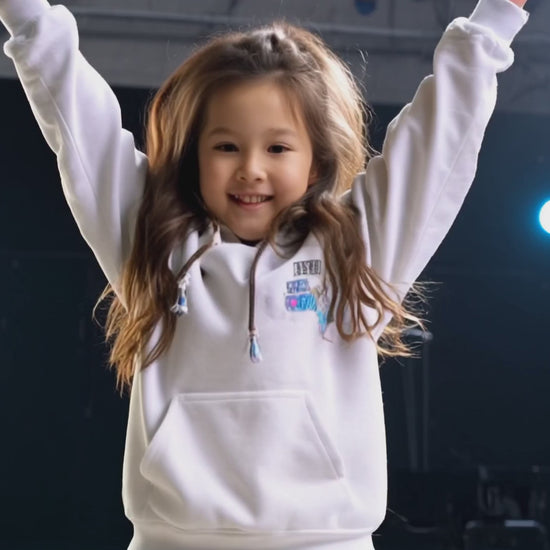 Mixed media: A girl dances with an animated monkey in a dance studio